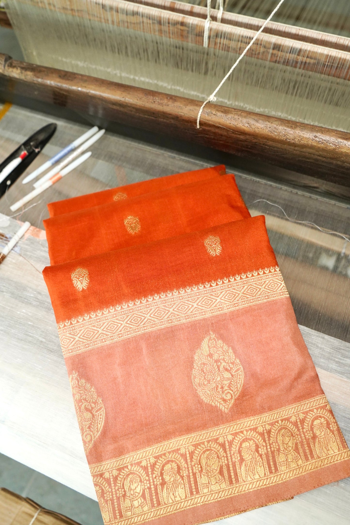 Burnt Orange Banarasi Silk Saree with Allover Buti Work