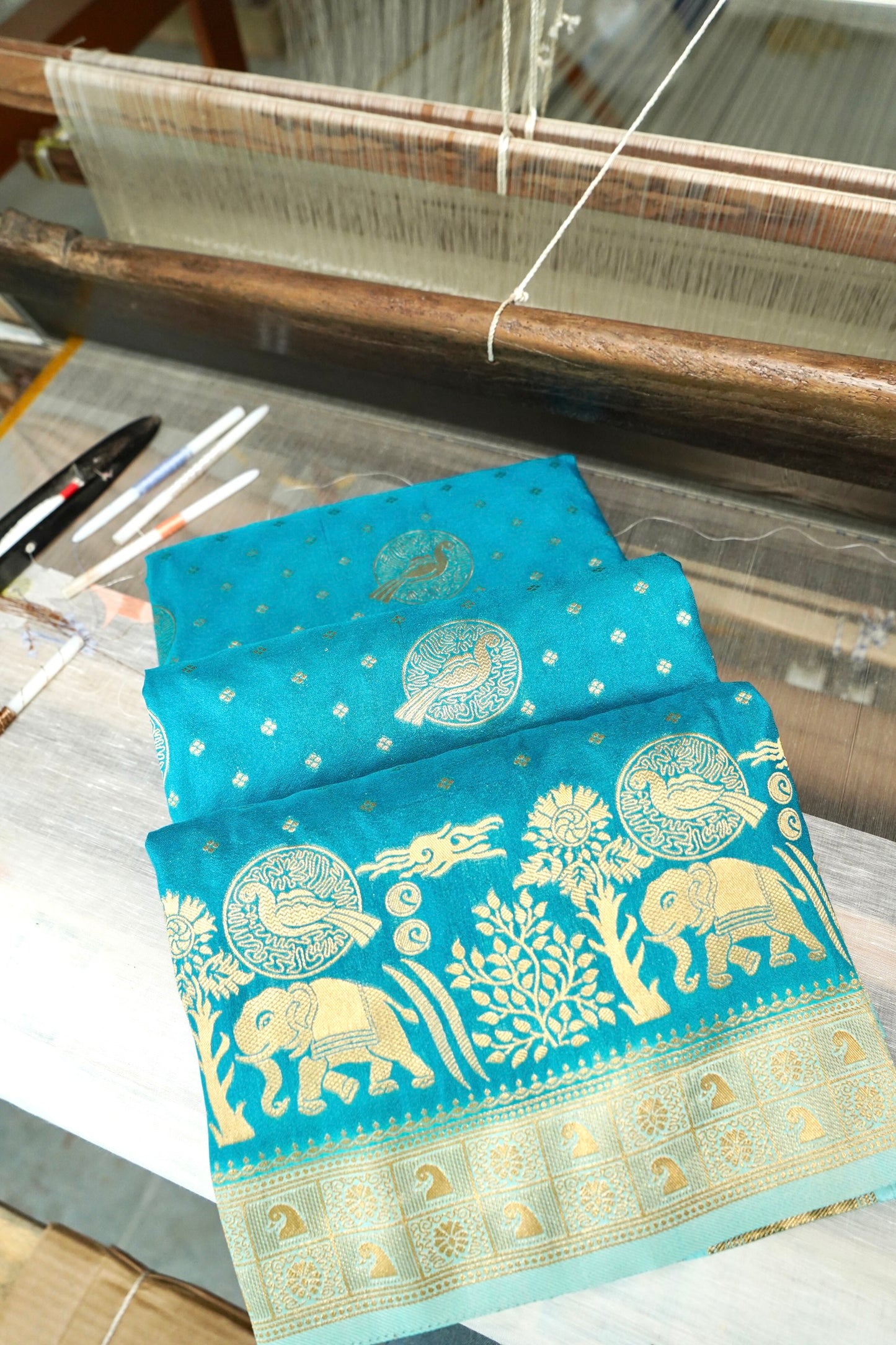 Turquoise Blue Banarasi Silk Saree with Animal Motif Weaves